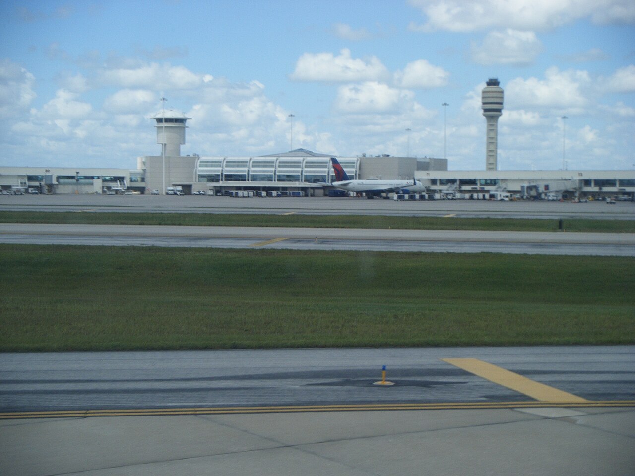 Orlando International Airport terminal exterior with palm trees